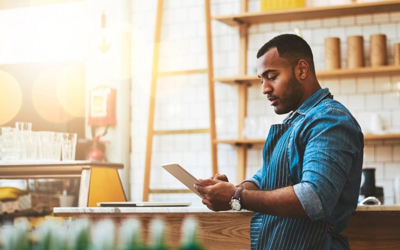 cafe-owner-looking-at-ipad