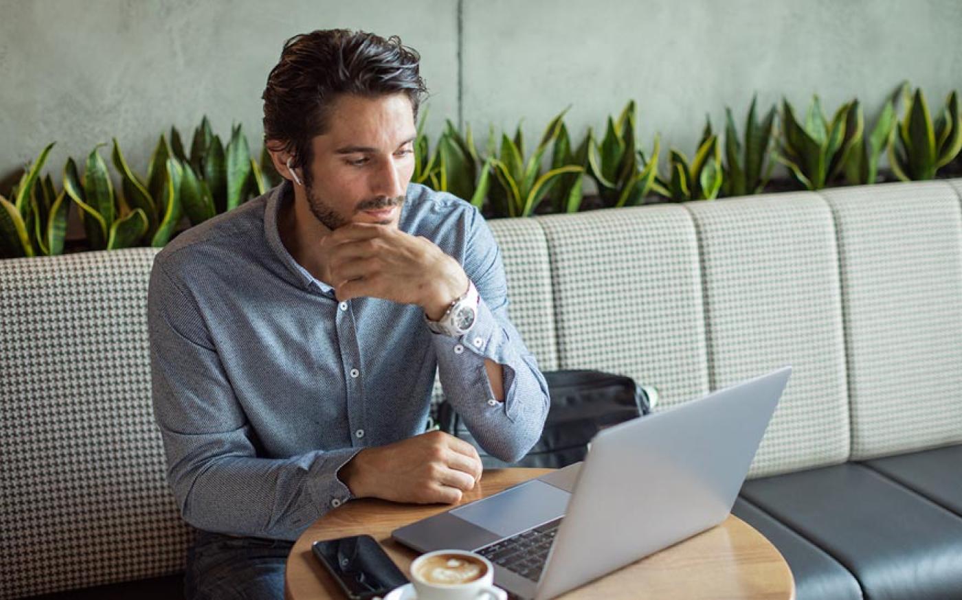 man-at-coffeshop-with-laptop